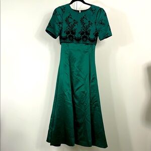 Elegant Green and Black Embroidered Dress
Size 2